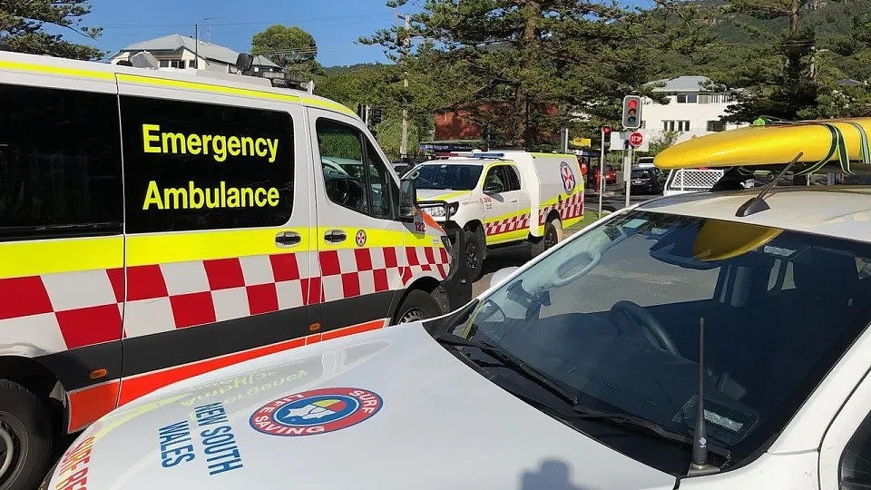 NSW paramedics treated three swimmers at Austinmer Beach on Friday after they became stuck in rips in two separate incidents. Picture: Anthony Turner