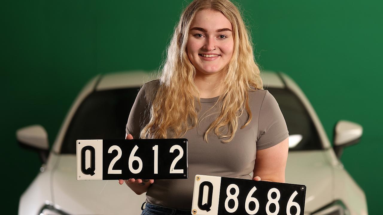 Abby Moynihan, 22, with some of the number plates that will go to auction next week. Picture: Liam Kidston