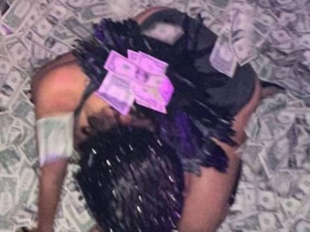 Photos of Censori swimming in a pool of cash, uploaded to West’s Instagram account.