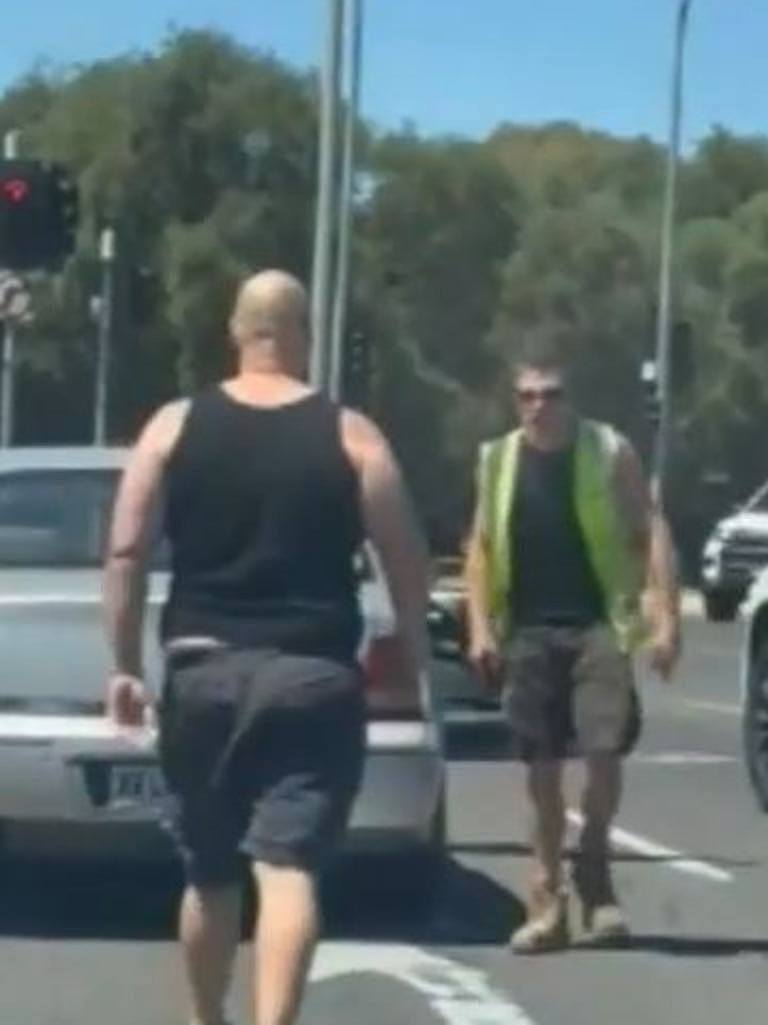 The men got out of their cars before charging at each other at an Adelaide intersection. Picture: 9News