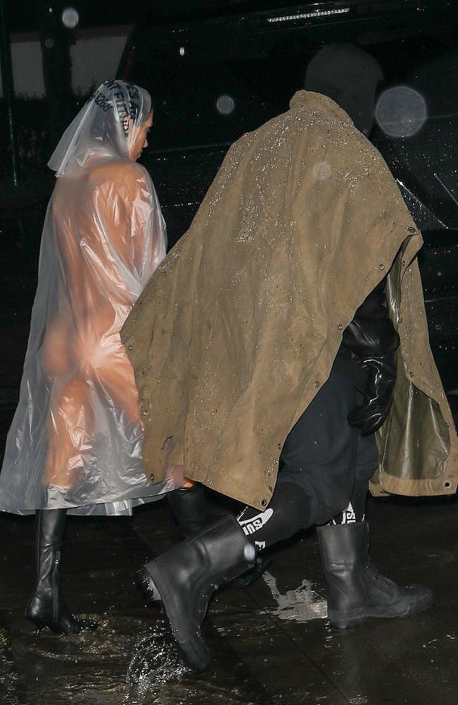 Bianca Censori stripped naked under a see-through poncho during an outing with Kanye West. Picture: The Daily Stardust/ Khrome / BACKGRID