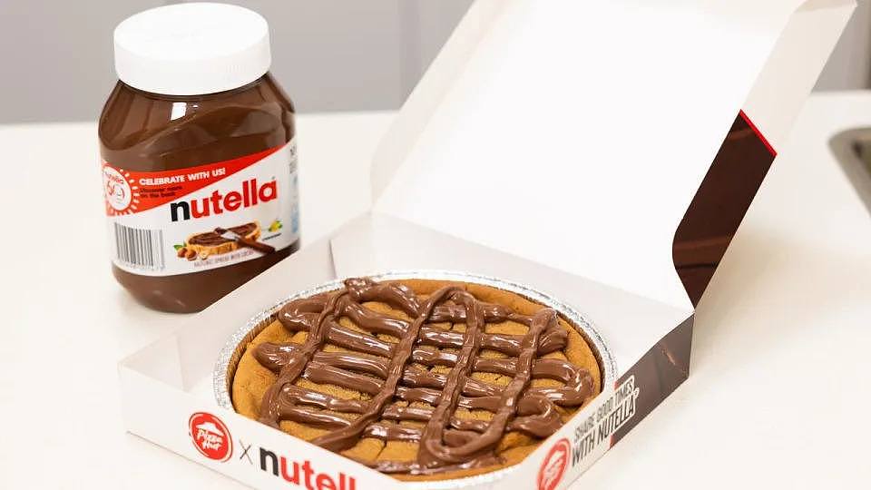 A decadent chocolate dessert is hitting the menus at a popular fast food chain. In a partnership between globally loved brands Pizza Hut and Nutella, a lush new menu item marrying the two companies together will be available from February 22: the loaded cookie with Nutella. Picture: Supplied