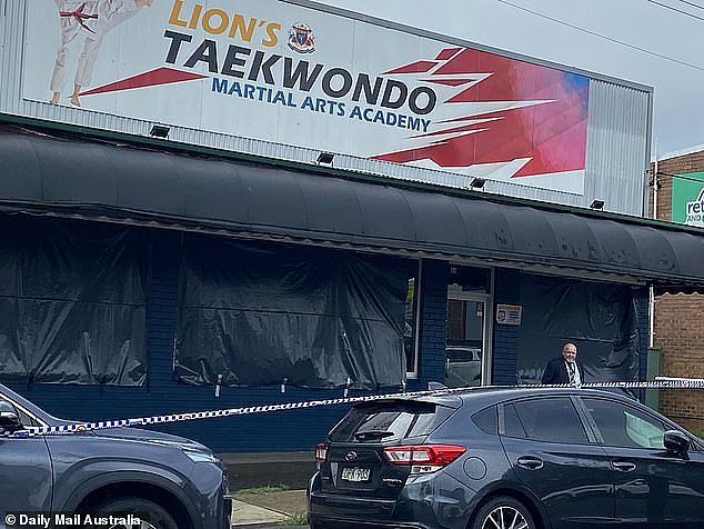 A crime scene at Lion's Taekwondo Academy in Daking Street, Parramatta, has also been sealed off, with firefighters covering up the windows of the martial arts studio