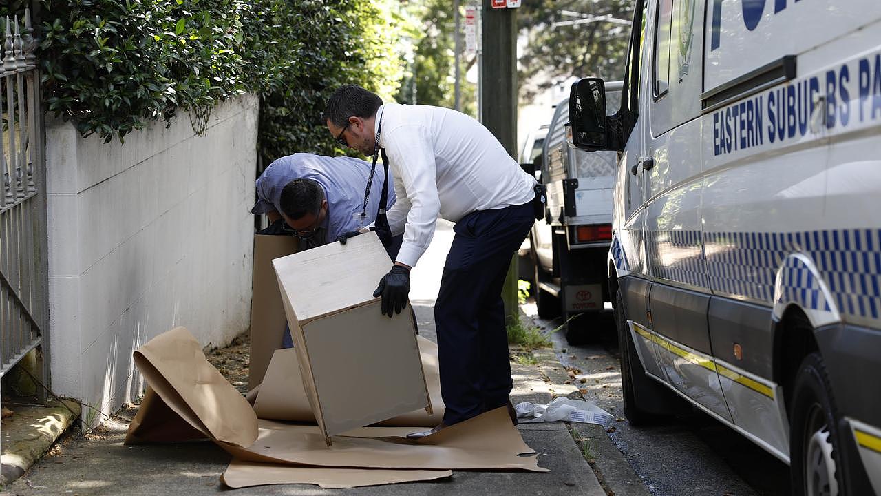 Detectives are sifting through the Paddington residence, removing furniture and wrapping it up as evidence. Picture: Richard Dobson