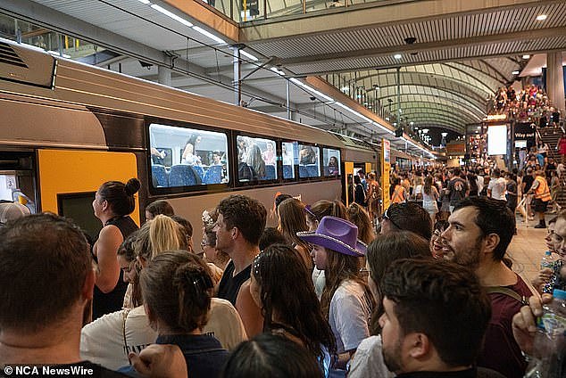 Crowds - which also included blink-182 fans from a gig at the neighbouring Qudos Bank Arena - were seen pouring into the station before being ferried on to trains