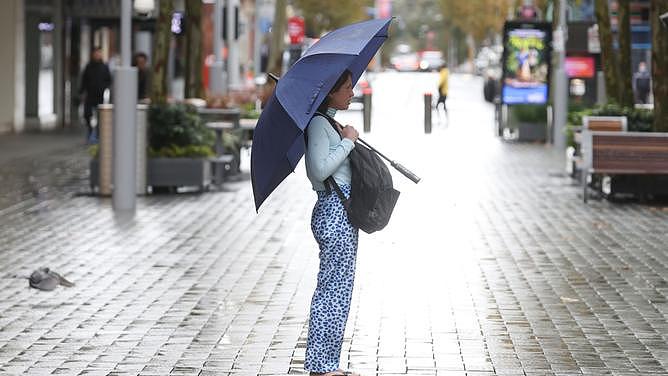 Perth is experiencing another wet rainy day. PIctured are pedestrians in the City