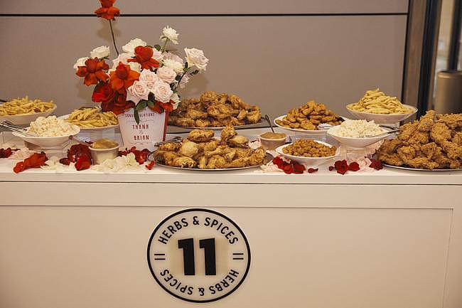 The wedding featured a KFC grazing table to offer guests Kentucky Fried Chicken, potato & gravy, coleslaw and more.