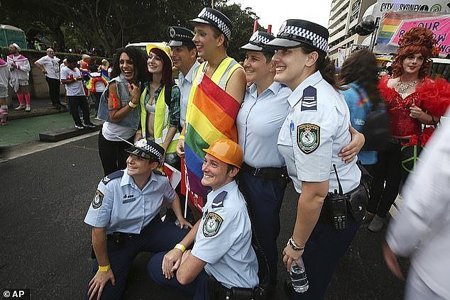 Police officers will be allowed to march in this Saturday's Mardi Gras parade in Sydney after event organisers backtracked on a decision made earlier this week (pictured, police at Mardi Gras)