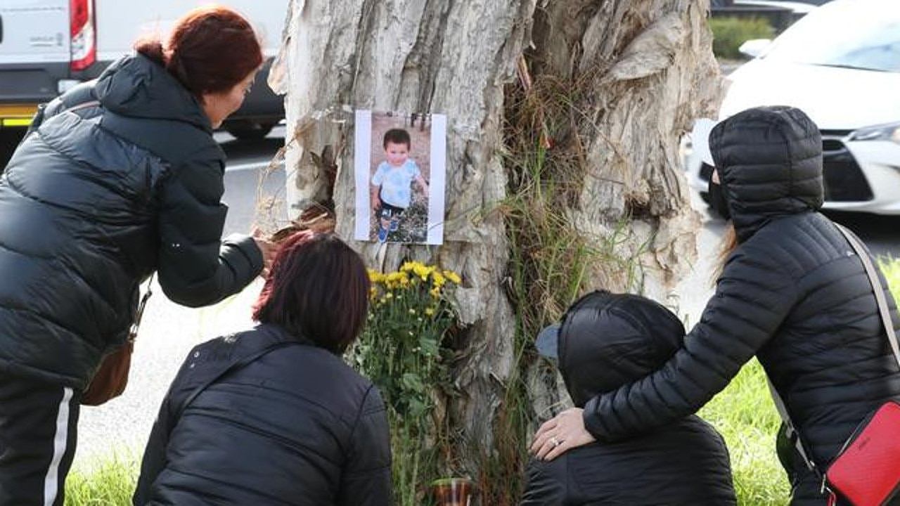 Family gather on McIntyre Rd, Sunshine North, to pay tribute to Ethan Nguyen. Photo: David Crosling