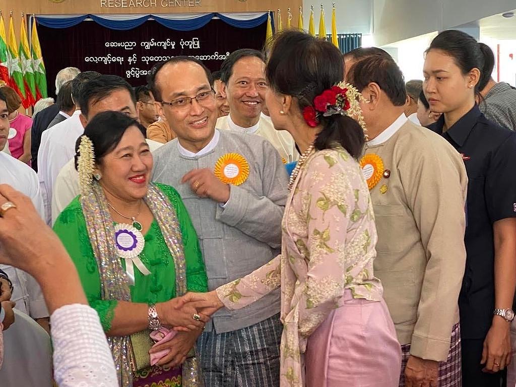 Burmese businesswoman Dr San San Yi shakes hands with Myanmar's then leader, Aung Sung Suu Kyi. Picture: Supplied