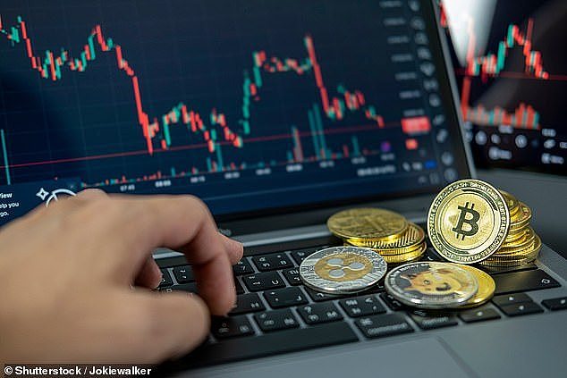 Commonwealth Bank introduced new measures last year to protect customers from cryptocurrency scams and fraud (pictured stock image of a bitcoin trader)