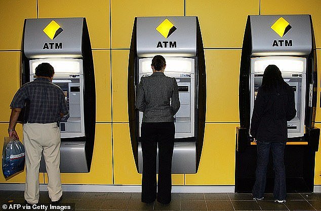 Customers were left outraged by the move to decline the transfer when an image of the statement provided by the bank was uploaded to social media (pictured people withdrawing cash at an ATM)