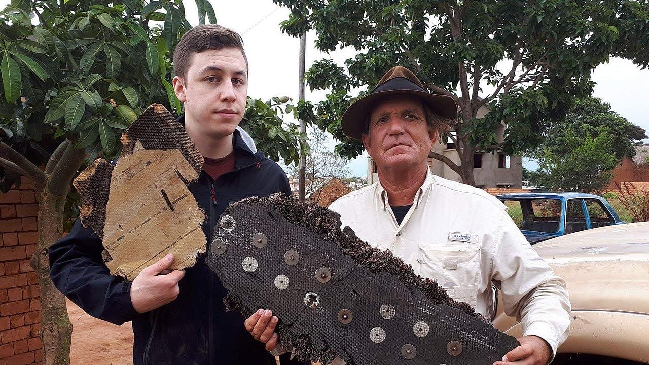 Plane wreck hunter Blaine Gibson (right) with pieces of debris of the missing MH370. Picture: supplied