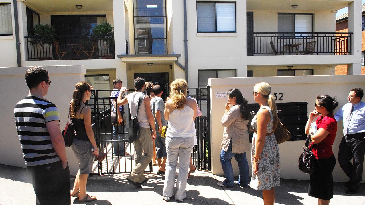 A group of prospective tenants queue outside a Clovelly complex to view a one-bed unit.