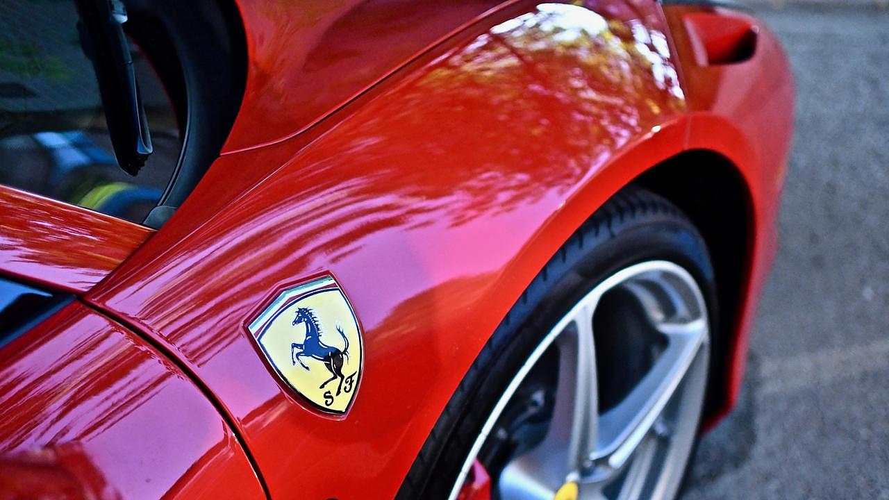 Mo Du allegedly bought Ferraris and other luxury cars with the money.