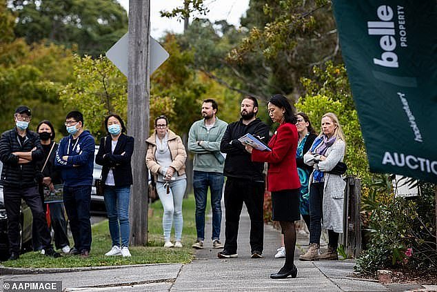 The most aggressive interest rises since 1989 had initially caused property values to fall in 2022 but in 2023, they soared again (pictured is a Melbourne auction)