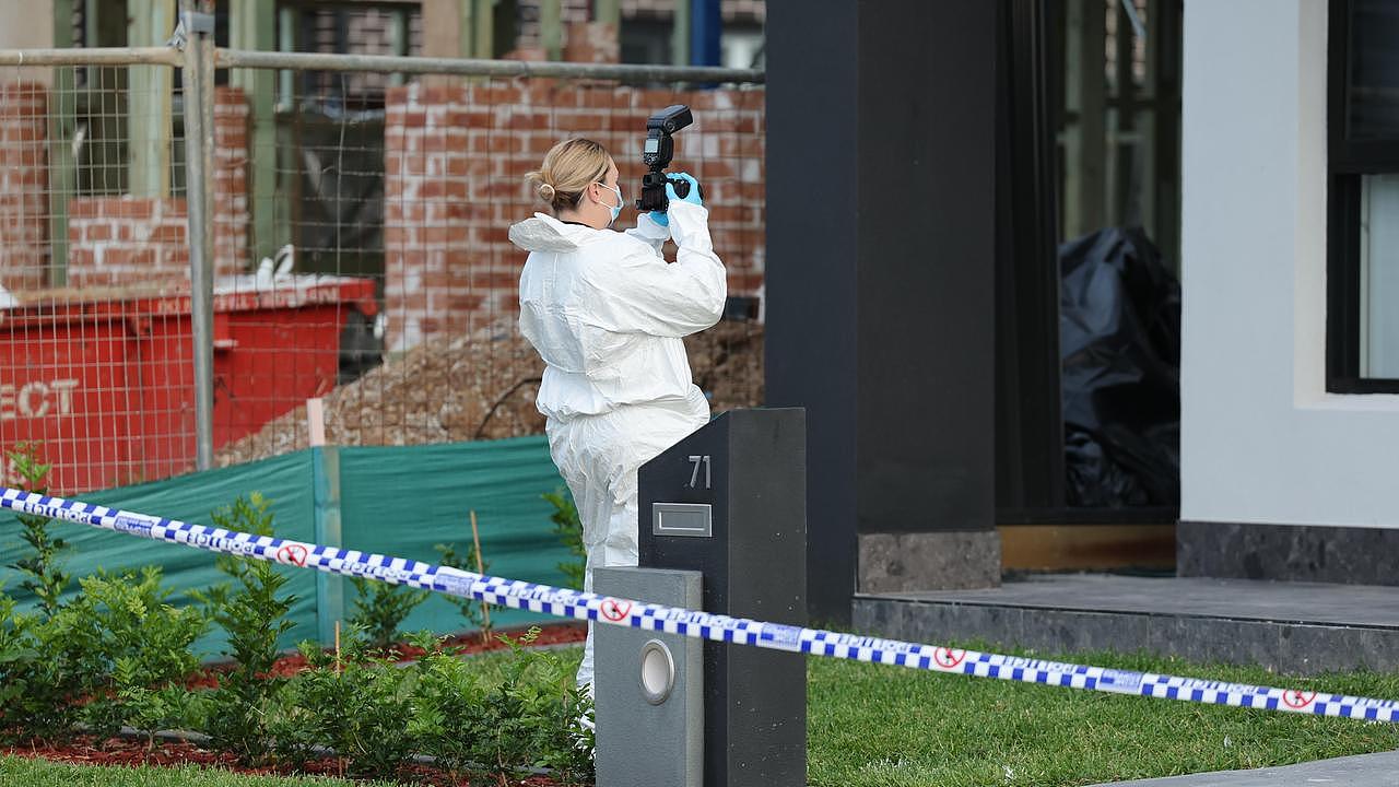 Police at the crime scene on Saturday. Picture: Tim Hunter.