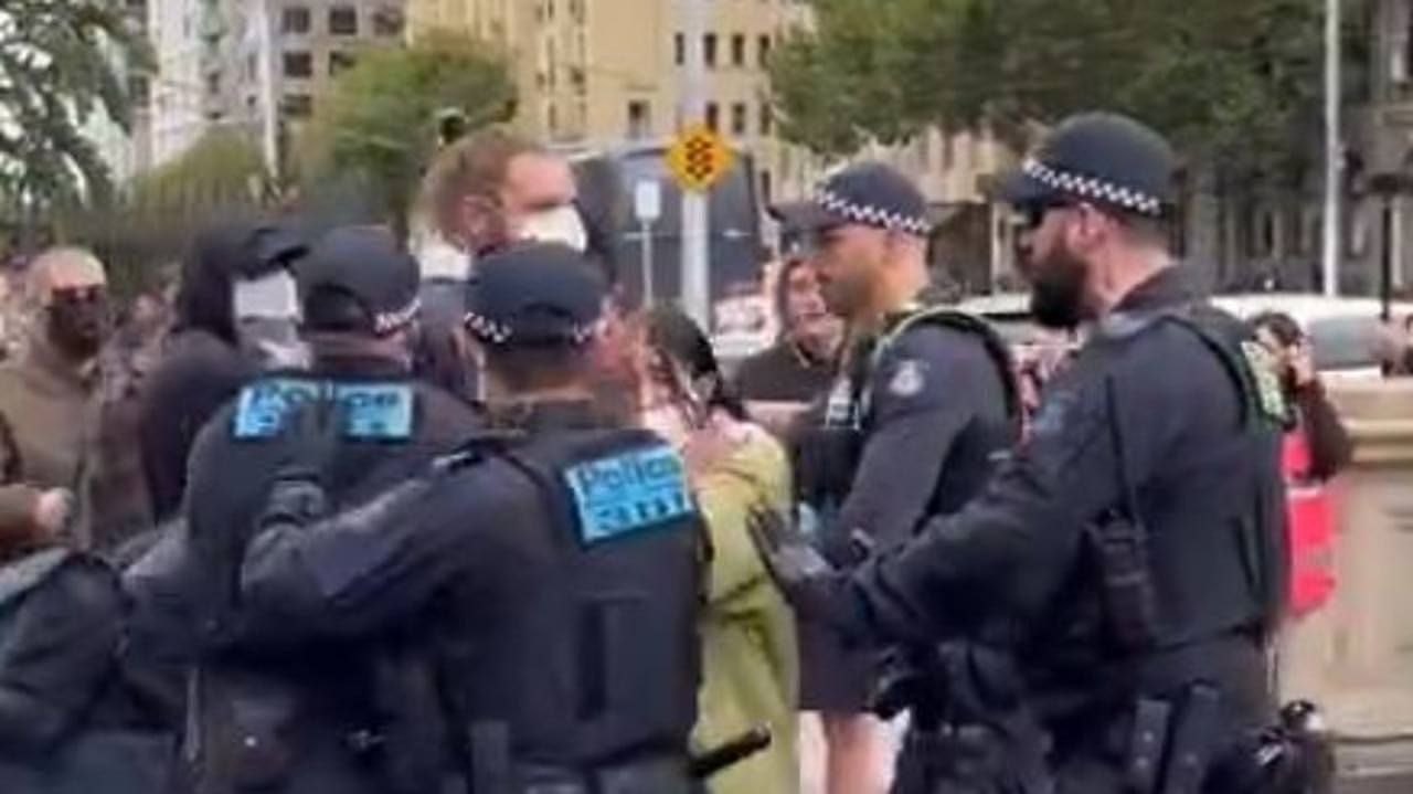 Police have deployed capsicum spray and pinned trans rights activists at a protest outside parliament. Picture: Mitch Clark