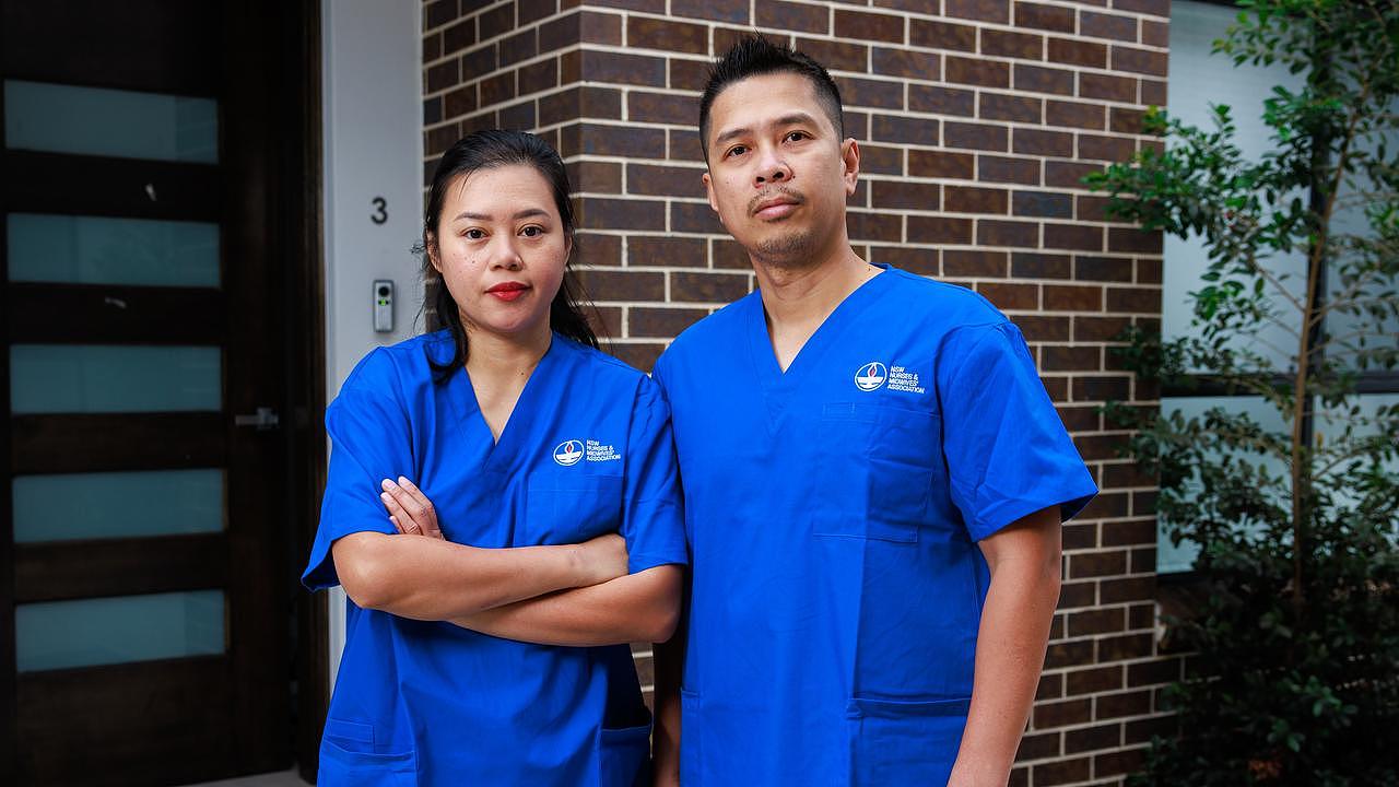 Nurses Lucy Anne and Jerwin Jacoba, at home, in South Wentworthville. Picture: Justin Lloyd