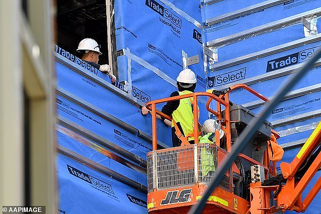 A construction worker has died after falling more than two metres at a building site, prompting a warning about a spike in similar incidents (pictured, construction workers in Sydney)