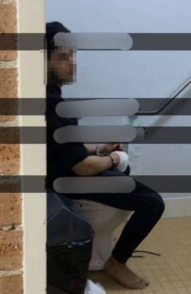 An image shows the teenager handcuffed with a wounded hand.
