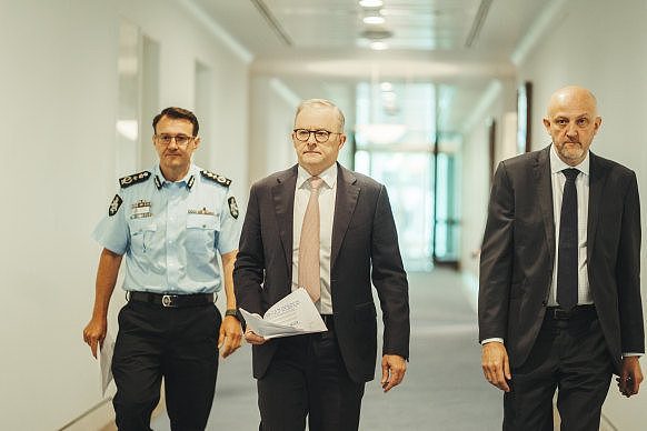 Prime Minister Anthony Albanese with Commissioner of the AFP Reece Kershaw and Director-General of Security of ASIO Mike Burgess ahead of a press conference at Parliament House on Tuesday morning. 