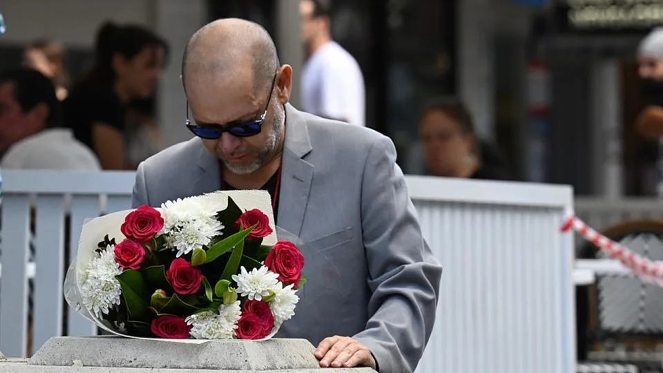 A man grieves the six people killed at Bondi Junction