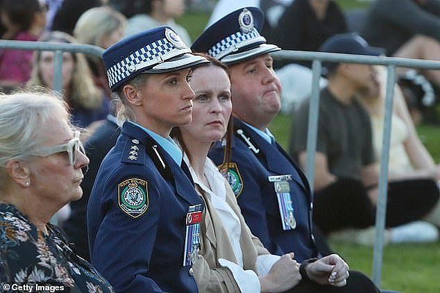 Hero cop, Inspector Amy Scott (pictured second left) chased down the lone attacker and shot him before he could injure anyone else