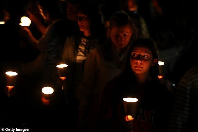 The vigil (pictured) followed a positive update on the health of nine-month-old baby Harriet who was stabbed during the attack