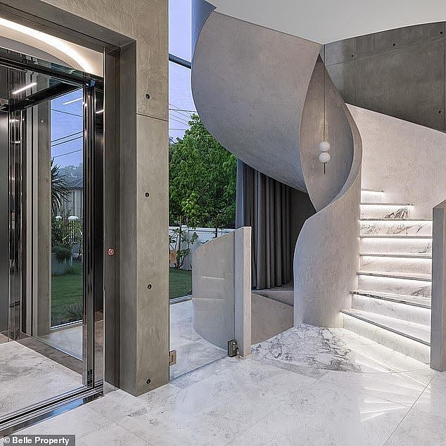 The luxury home boasts five bedrooms and six bathrooms, with concrete, Italian marble, European oak, travertine and limestone throughout (pictured)