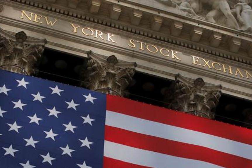 A US flag flies outside Wall Street at the  New York Stock Exchange