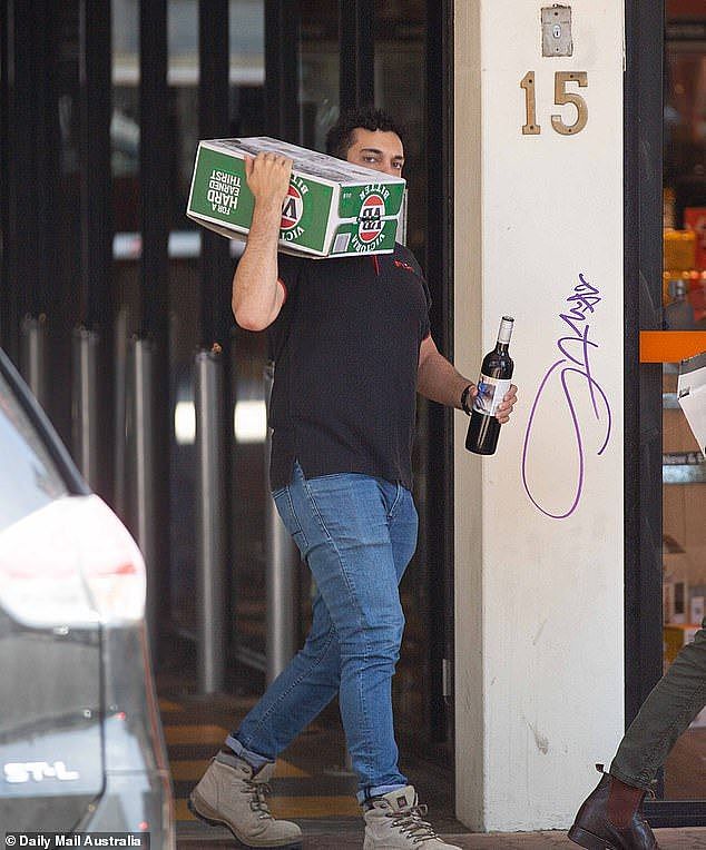 A second glass of beer or wine can have serious affects on eyesight and can accelerate the risk of age-related macular degeneration. Pictured is an Aussie stocking up on alcohol