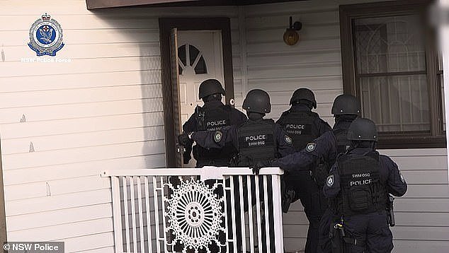 Dozens of officers raided the Fairfield West home in Sydney's south-west