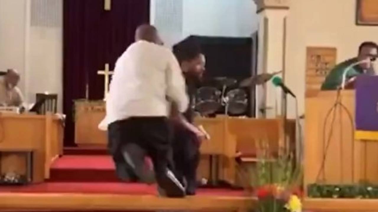 The church deacon tackled the gunman to the ground.
