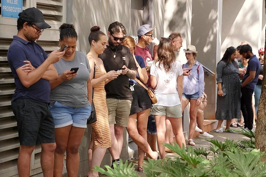 People waiting in line to view a rental property in Sydney