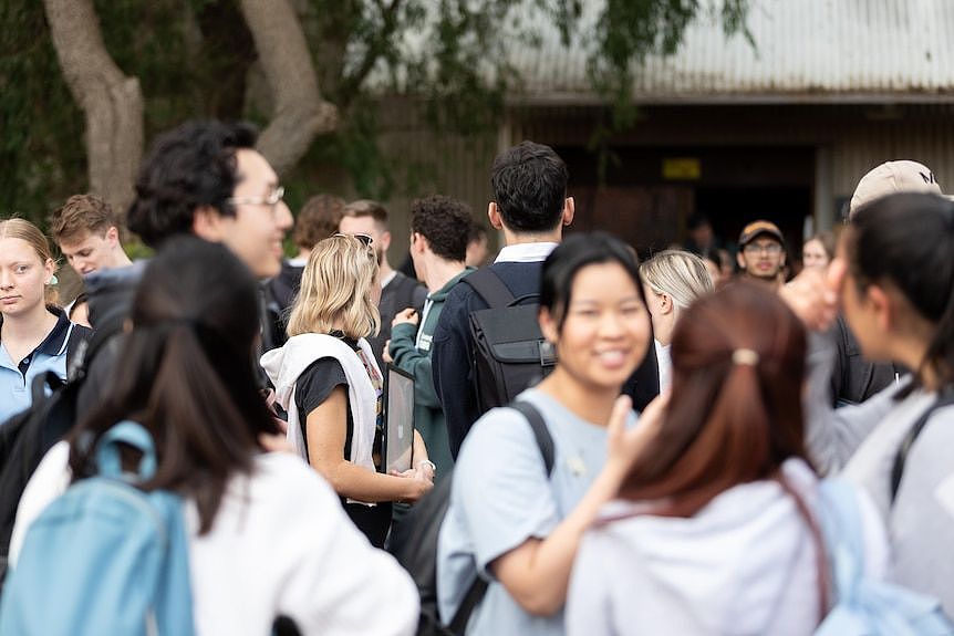 University students in a large crowd outside