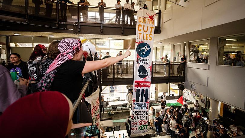 Students and pro-Palestine supporters marched through Curtin University today before running past security and occupying the Engineering Pavilion. Michael Wilson