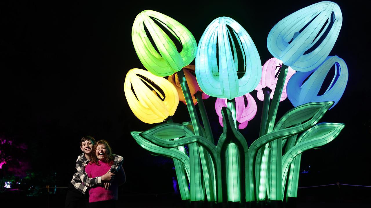 Lana and Jackson with giant illuminated tulips at the Garden. Picture: Jonathan Ng
