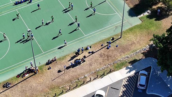 Children at a set of Fremantle netball courts were ushered out of the way as police descended on an alleged knife-wielding man at gunpoint on Wednesday. 