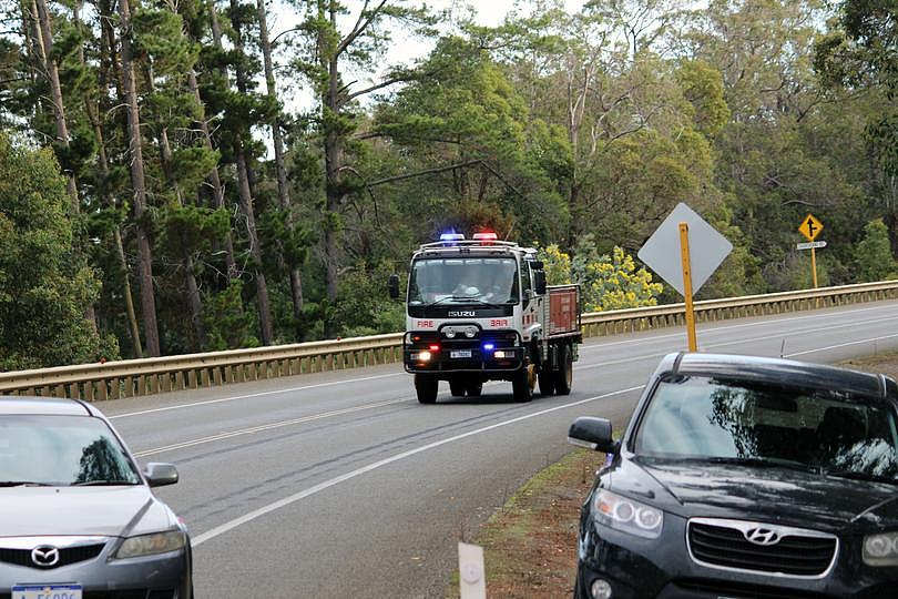 Emergency services attended a collision between a grain truck and a car on South Coast Highway Friday.