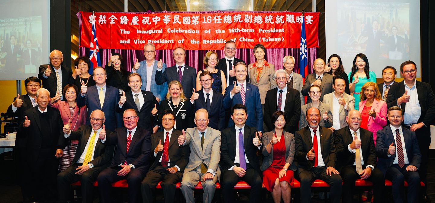 australian mps hold their thumbs up at an event celebrating the inauguration of Taiwan's new president