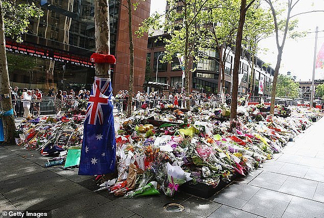 Flowers are pictured outside the Lindt Cafe in Martin Place, Sydney on December 23, 2014