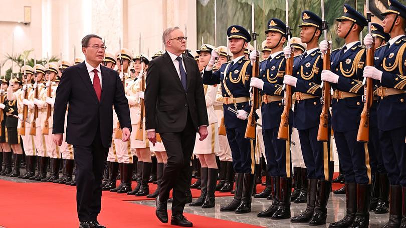 Prime Minister Anthony Albanese (right) arrives to a Ceremonial Welcome with Chinese Premier Li Qiang (left).
