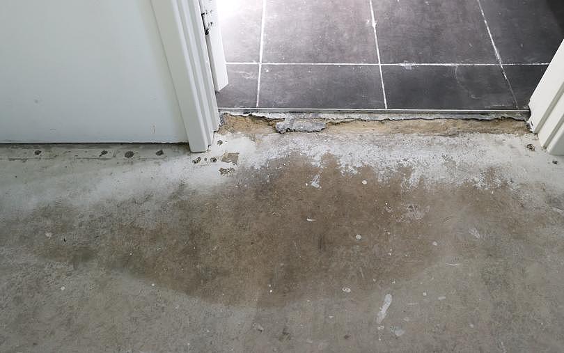 Thousands of WA homeowners impacted by the defective Iplex pipe saga. Pictured - Stained concrete and damaged tiling in the daughters bedroom