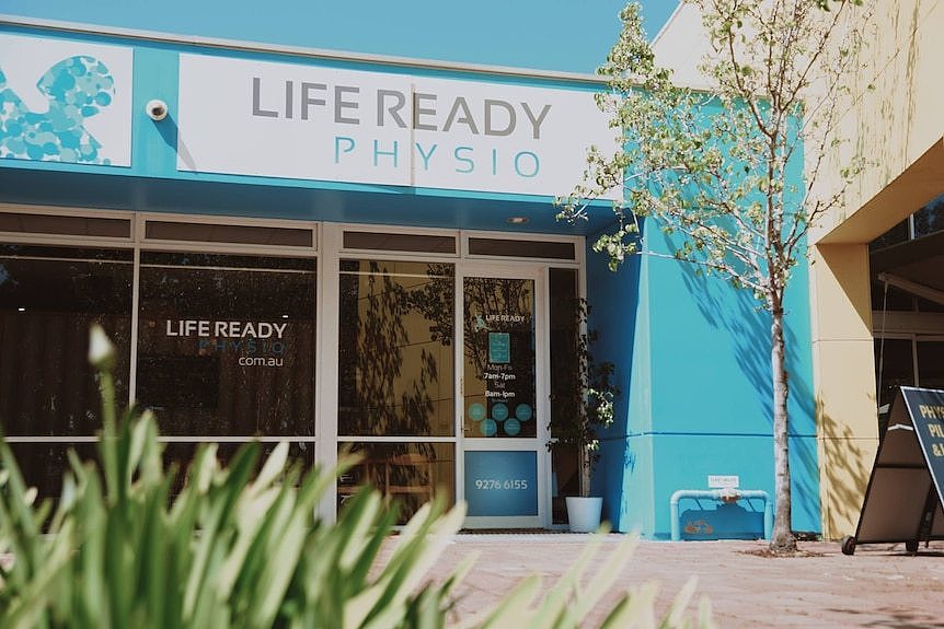 A shopfront with blue signage reading Life Ready Physio.