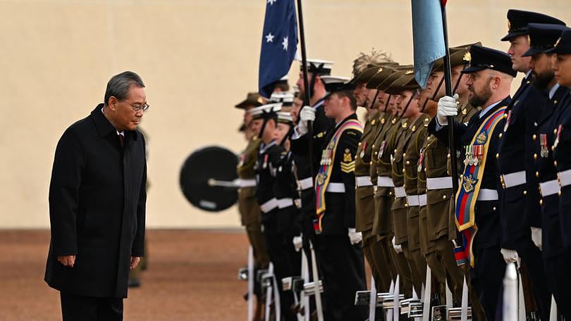 Chinese Premier Li Qiang inspects a guard of honour outside the Australian Parliament House on June 17, 2024 in Canberra, Australia. 