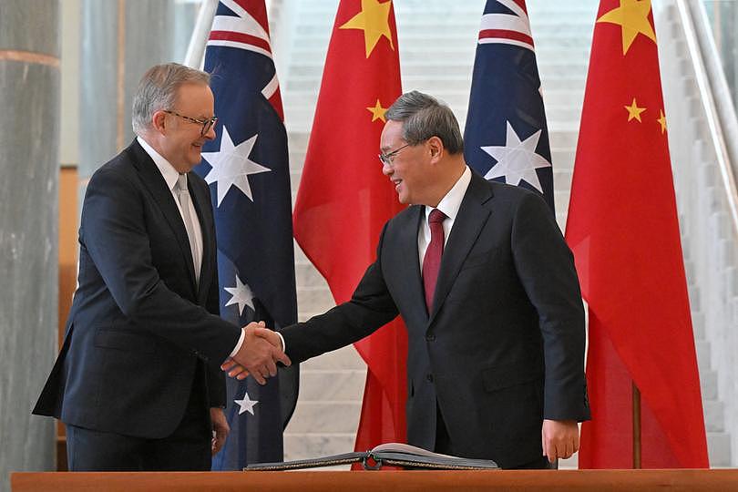 CANBERRA, AUSTRALIA - JUNE 17: Chinese Premier Li Qiang shake hands with Australia's Prime Minister Anthony Albanese looks on at Australian Parliament House on June 17, 2024 in Canberra, Australia. Li's visit to Australia aims to strengthen bilateral ties and address outstanding trade and consular issues, including the removal of remaining trade barriers and the release of imprisoned Australian democracy blogger Yang Hengjuno, marking a significant step towards stabilizing the relationship between the two nations. The visit also highlights the growing importance of economic cooperation and the need for dialogue on security concerns, particularly in the context of China's increasing influence in the Pacific region. The visit marks the first high-level diplomatic by a Chinese leader to Australia since 2017. (Photo by Mick Tsikas - Pool/Getty Images)