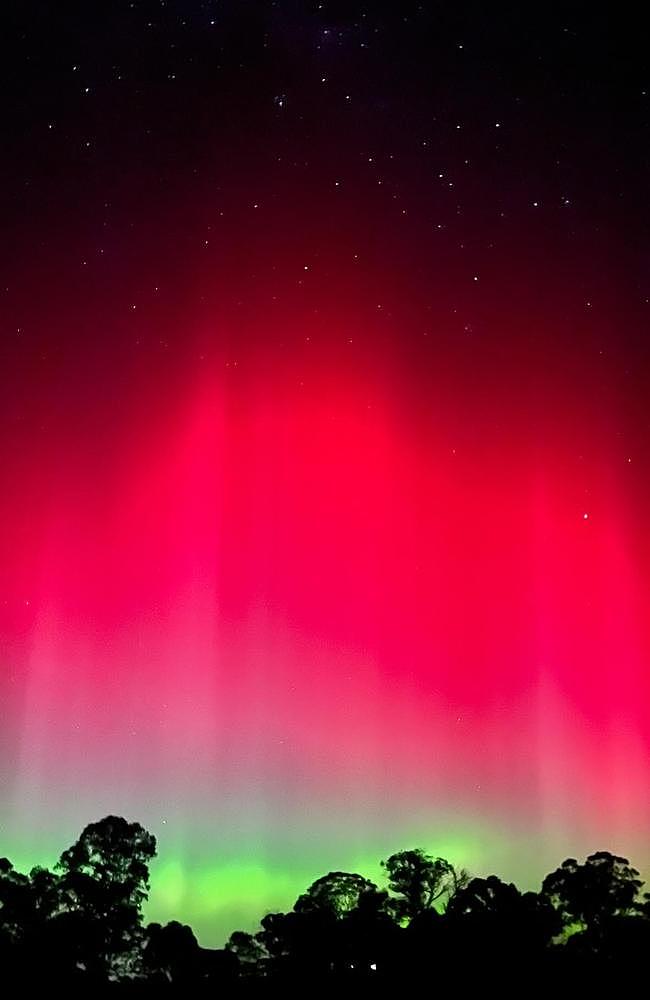 The dazzling pink and green southern lights spectacle was visible in Sugarloaf Creek during the May Aurora Australis event. Picture: Remi Lezon