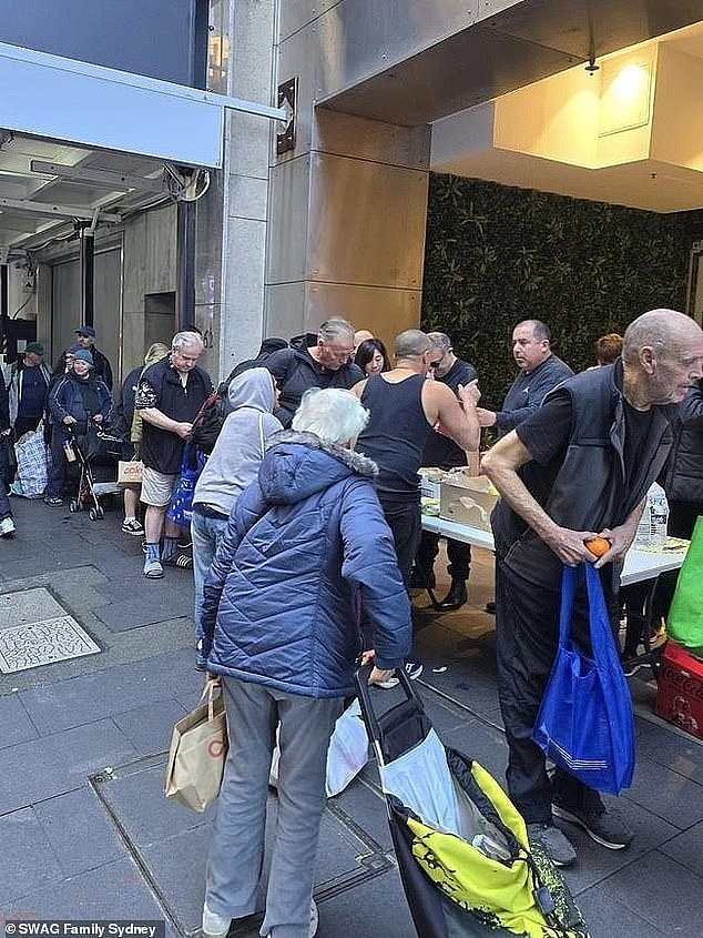 SWAG Family Sydney president Ricky Herrera photographed the heartbreaking scene outside one of the food collection points at Martin Place, in Sydney's CBD