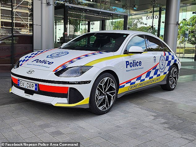 The sedan, on loan from the manufacturer, will be used by officers in their day-to-day activities and can be seen cruising the streets with the number plates 'EV COP' (pictured)